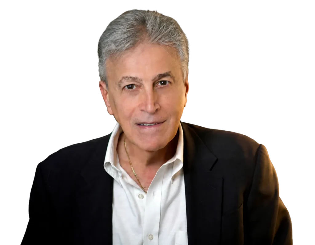 TraumaSolutions A man with gray hair wearing a dark jacket over a white collared shirt, facing forward against a white background—his calm demeanor suggests someone experienced in deep processing and trauma work such as Brainspotting.